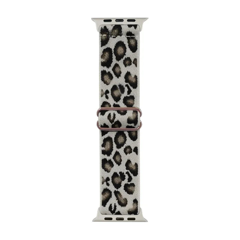 A fashion leopard print nylon Apple Watch band with a silver buckle.