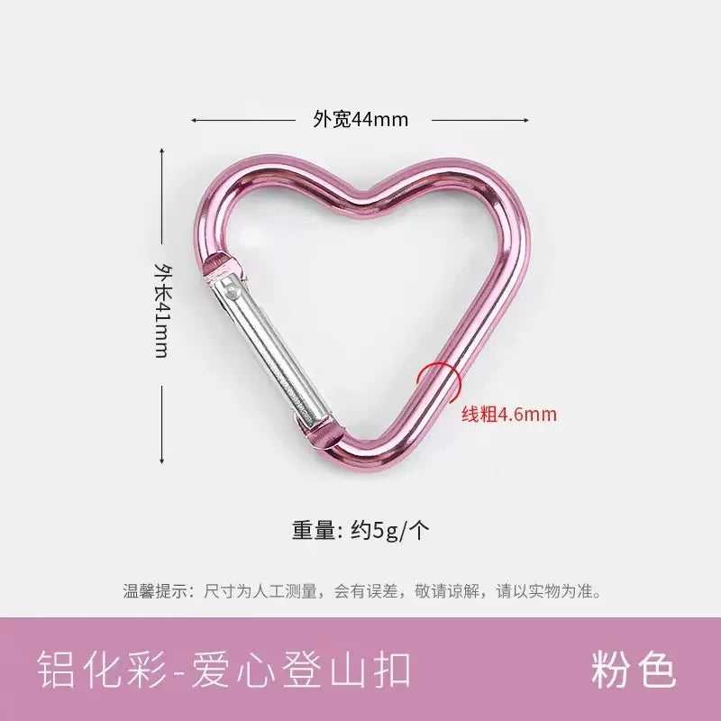 A pink heart-shaped spring clasp and carabiner keychain, measuring 44mm externally.