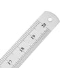 A silver measuring ruler showing markings from 17 to 20, with a hole at the end.