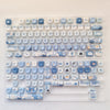 A collection of blue sea themed PBT keycaps for a mechanical keyboard.
