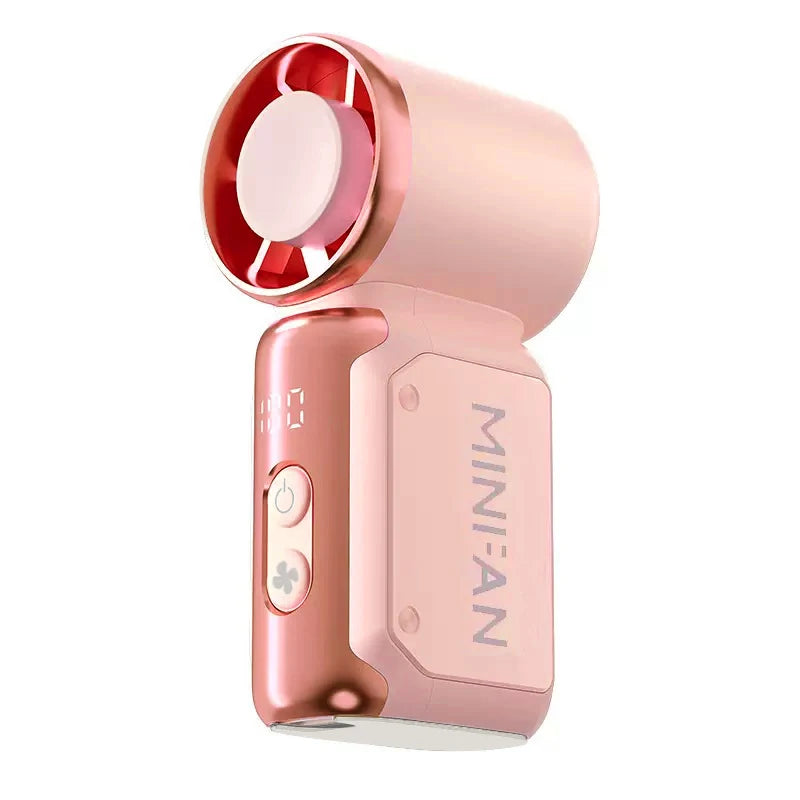 A pink portable USB rechargeable mini fan with a rotating blade visible on the top.