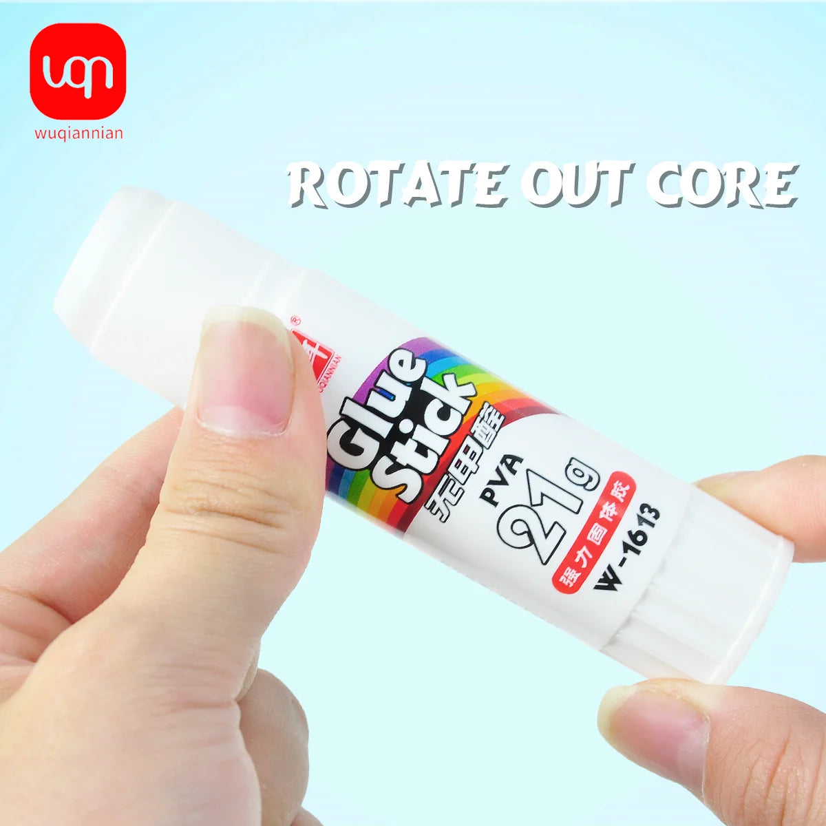 A hand is holding a white glue stick with colorful packaging, labeled PVA glue, for crafting.