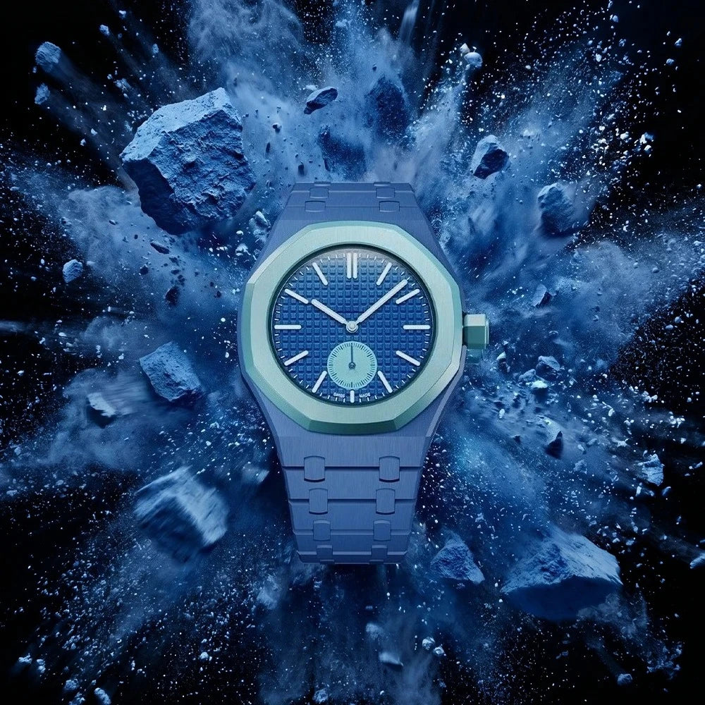 A close-up of a blue ceramic watch with a matching strap, surrounded by an explosion of blue dust.