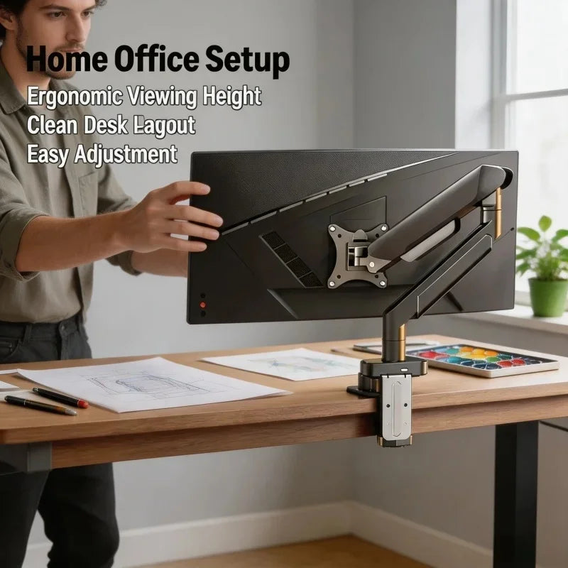 A person adjusts an ergonomic monitor arm setup for a home office desk.