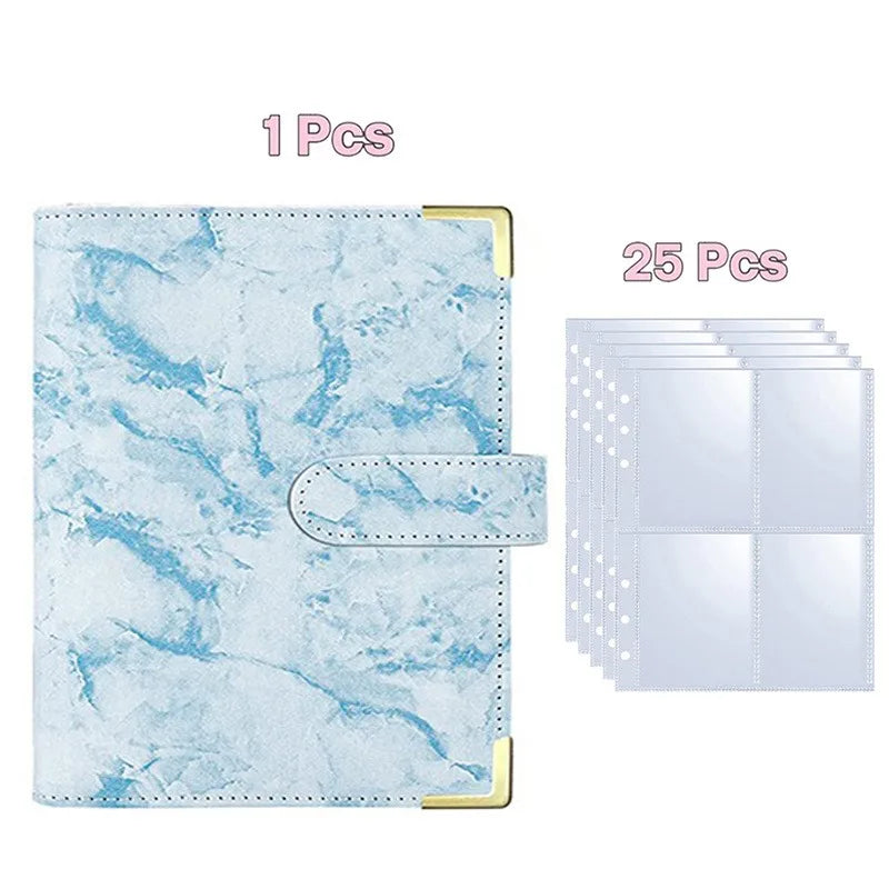 A stack of 25 clear plastic photo album binders with a light blue marbled cover and gold accents.