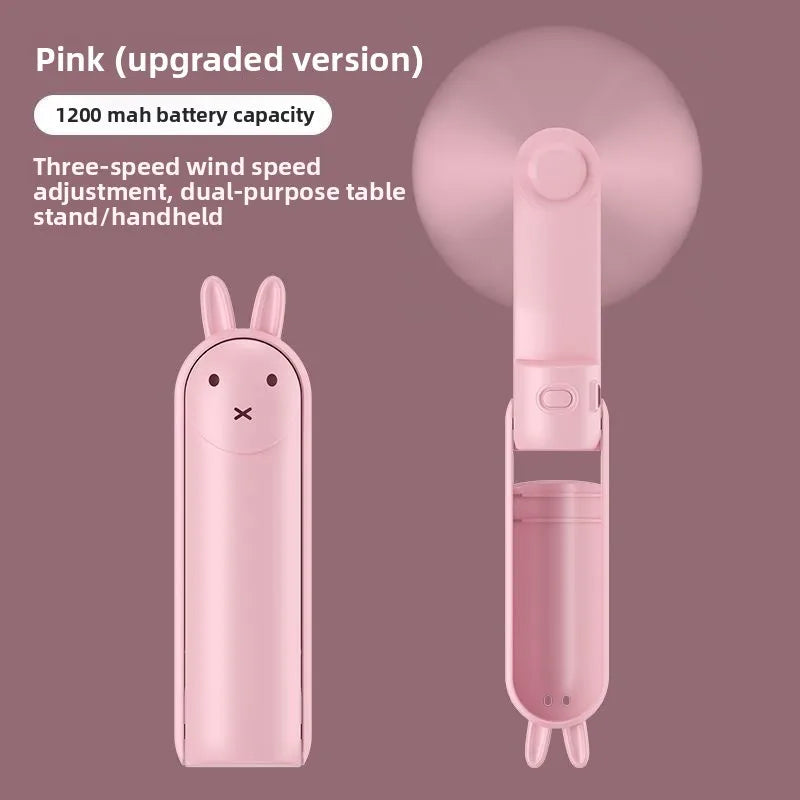 A pink portable foldable rabbit mini fan with a built-in battery and adjustable features.