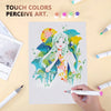 A hand holds an alcohol marker drawing a girl with vibrant colors on white paper surrounded by various colored markers.