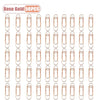 A set of rose gold metal pen clips designed for securing pages in notebooks and journals.