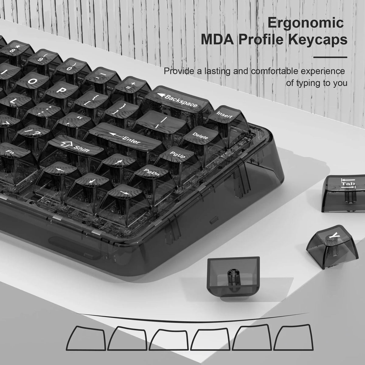 A close-up view of black MDA profile keycaps for a mechanical keyboard, showing various keycap shapes.