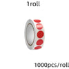 A roll of round assorted color dot labels for organization, showing a cylindrical roll with red and white dots.
