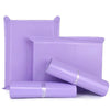 Purple waterproof self-adhesive courier mailer bags stacked and laid out.