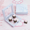 A clear plastic case holds several pink and brown cat paw keycaps for MX switches on a pink background.