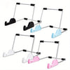 A set of four foldable aluminum tablet and laptop stands in black, light blue, and pink colors.