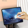 A hand is painting on a tablet screen displaying a night sky, demonstrating smooth painting creation.
