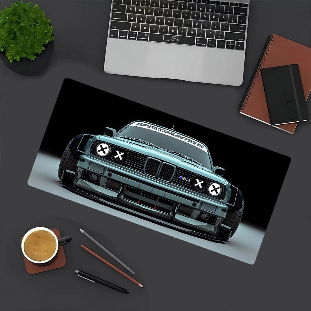 A black JDM car design gaming mouse pad featuring a detailed model of a black BMW on a dark background.