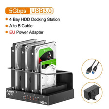 A black 4-bay HDD docking station with four drive slots and an EU power adapter.