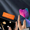 A hand holds a smartphone displaying a screen protector film for long-term oil control and fingerprint resistance.