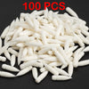 100 pieces of white acrylic art markers scattered on a dark surface
