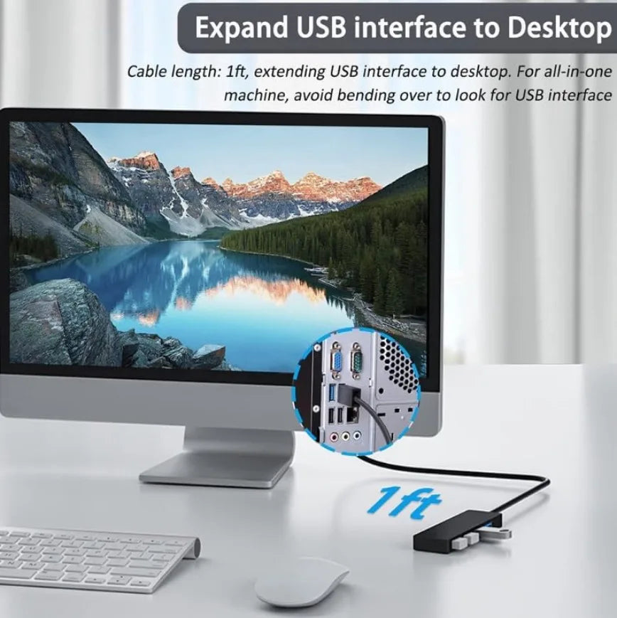A black USB hub adapter is shown next to a laptop and keyboard, demonstrating its use for expanding a USB interface to a desk