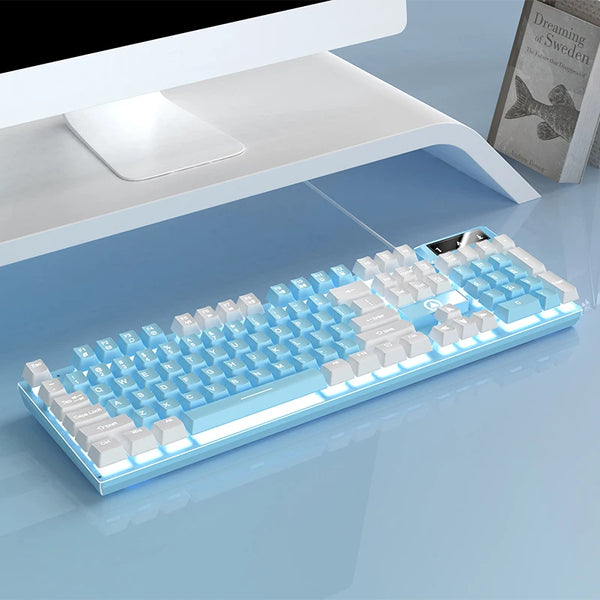 A light blue low profile wired gaming keyboard with a full numeric keypad is shown on a smooth surface.