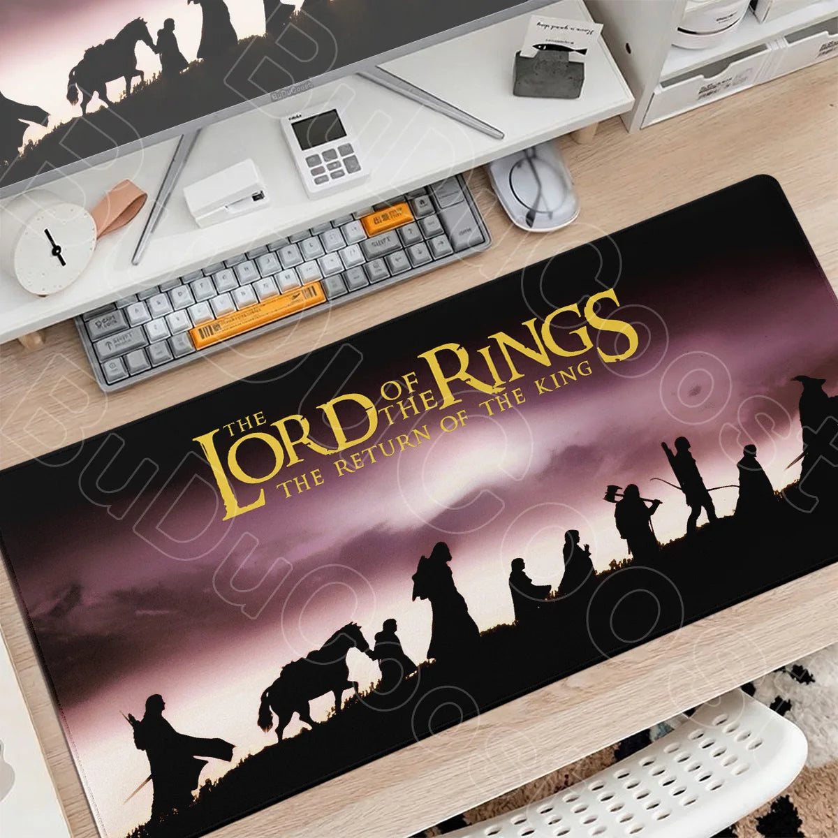 A large Lord of the Rings themed gaming mouse pad desk mat featuring a silhouette of characters and landscape.