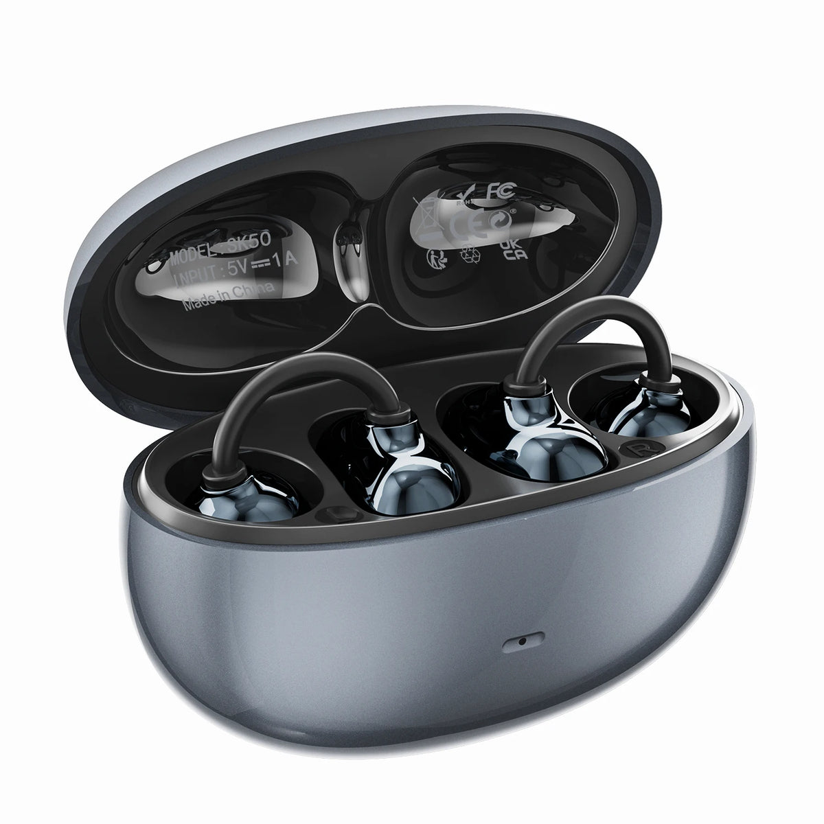 A silver charging case for open ear clip Bluetooth earbuds, shown open with the earbuds inside.