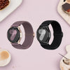 A close-up of a purple braided loop watch band and a black silicone strap for Garmin devices.