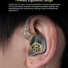 A close-up of KZ EDX Lite in-ear monitors being placed into a person's ear.