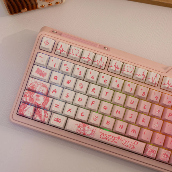 A close-up of a pink mechanical keyboard featuring PBT side-printed translucent keycaps with heart and ECG graphics.