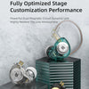 A pair of clear and gold dynamic earphones displayed on stacked dark green and silver hexagonal stands.
