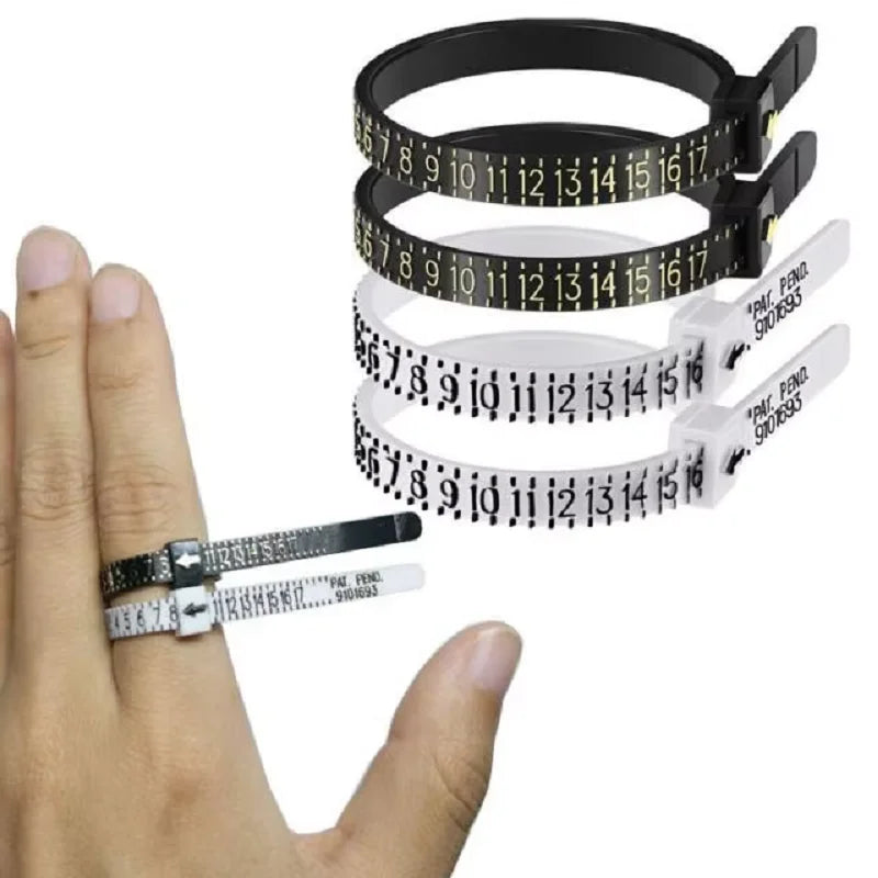 A hand holds several black and white reusable ring sizer measuring tools for accurate finger sizing.