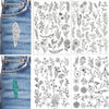 Sheet of water-soluble embroidery paper featuring pre-printed floral patterns on denim fabric.