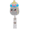 A glittery, cartoon-themed badge reel holder shaped like a yellow ice cream cone with blue stripes and pink accents.