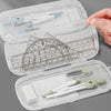 A clear plastic case holds a precision set of measuring tools including pens and tweezers.