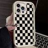 A white checkered silicone phone case is shown on a smartphone next to a laptop.