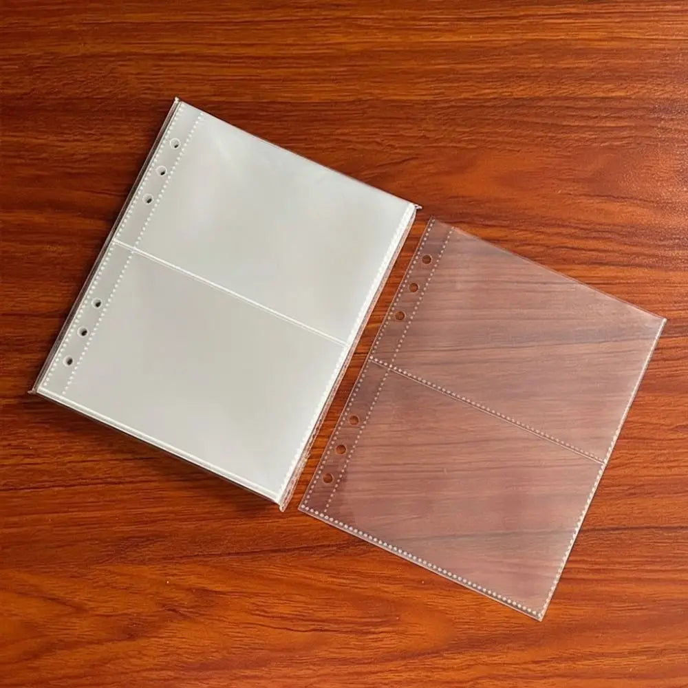 A set of A5 transparent photo card binder sleeves lying on a wooden surface.