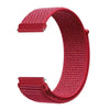 A close-up view of a red woven nylon watch strap with a buckle, showing the texture and adjustable loop.