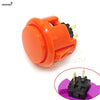 Orange arcade push button with a black micro switch and mounting hardware