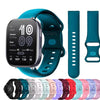 A silicone watchband for an Amazfit Bip 6 shown alongside a smartwatch and various colored silicone bands.
