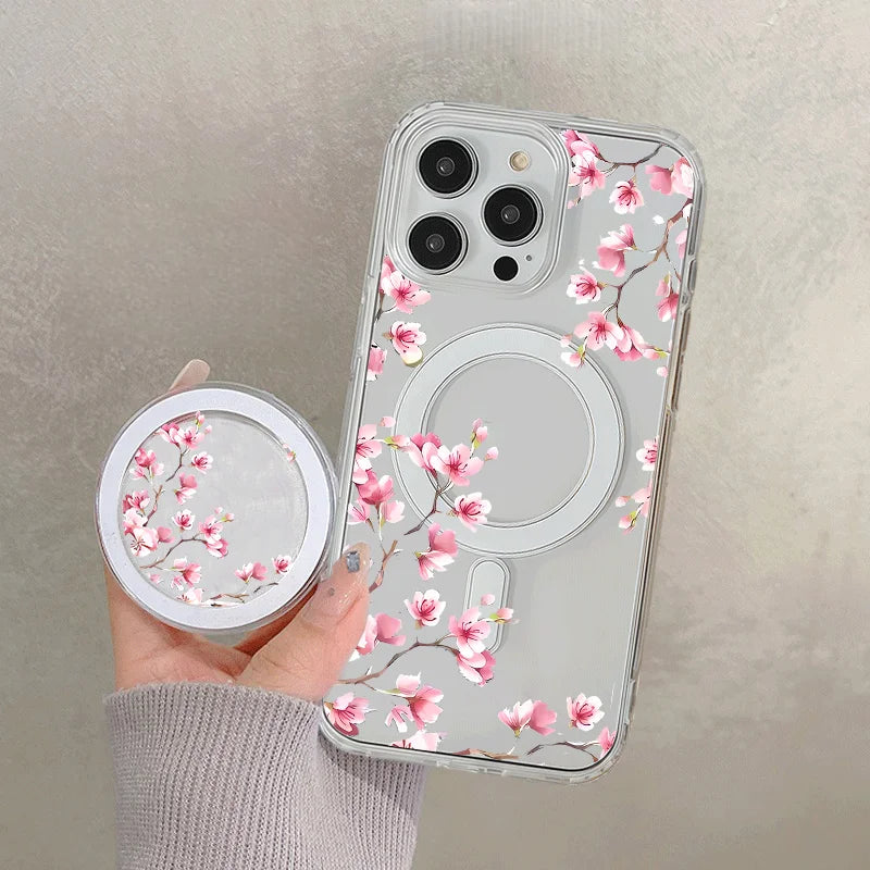 A clear floral magnetic phone case for an iPhone featuring pink blossoms and a circular cutout.