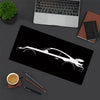A black mouse pad featuring a white silhouette of a JDM car design on a dark gray surface.