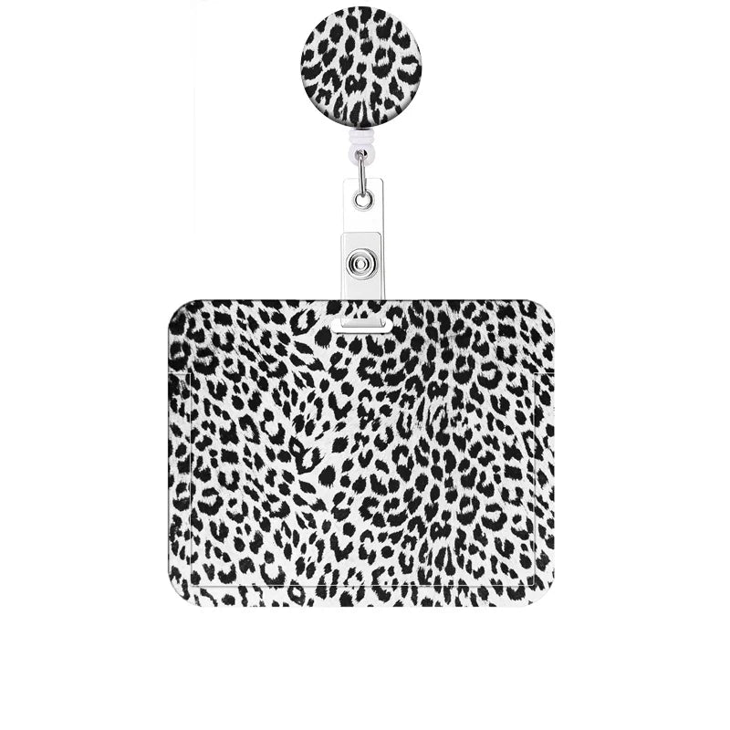 A leopard print retractable badge holder with a circular clip.