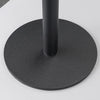 A black magnetic stand with a circular base and a vertical pole, designed to hold a phone or tablet.