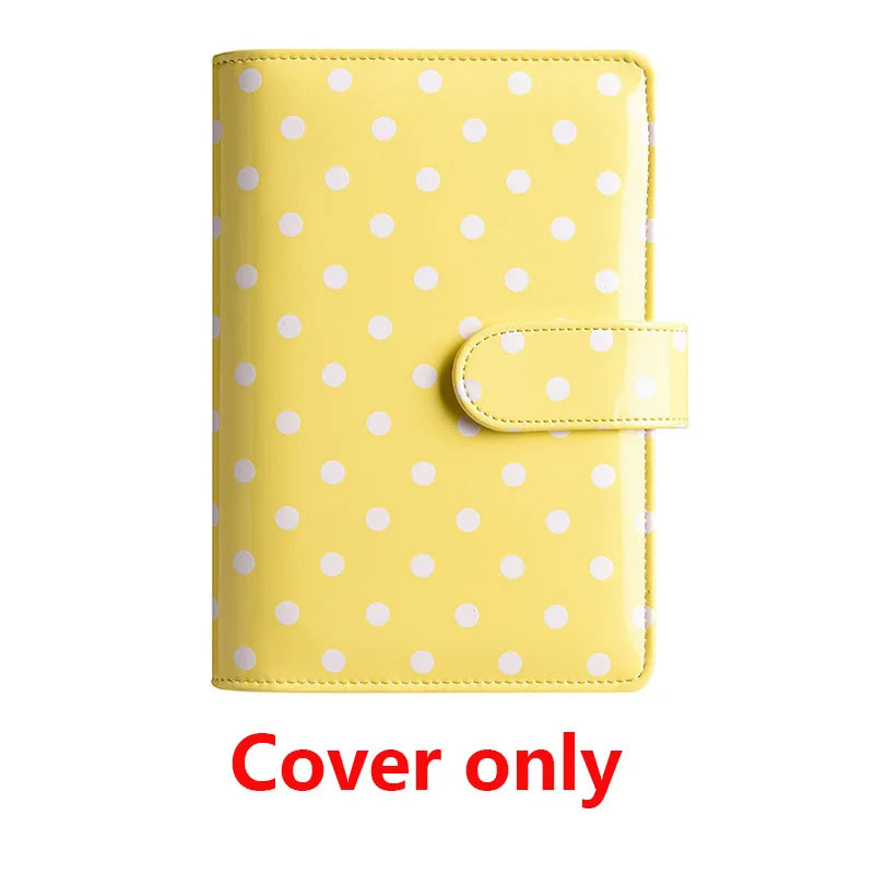Yellow PU leather binder cover with white polka dots and a clear plastic pocket.