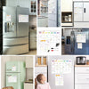 A collection of magnetic dry erase planner boards and kitchen appliances, including a refrigerator and toaster.