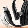 A close-up of a black braided USB-C cable with a connector and a quality test mark.