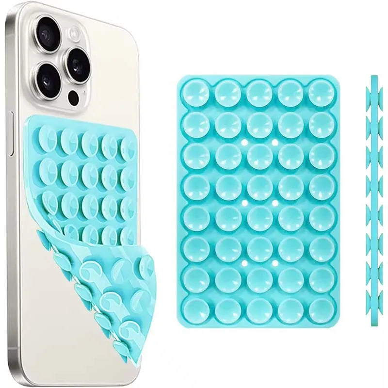 A white smartphone case and a blue silicone suction cup mount with multiple holes for mounting.