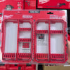 A red Milwaukee PACKOUT medium customizable bit storage case with multiple removable rows for tool bits.