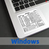 A close-up view of a Windows shortcut quick reference sticker on a laptop keyboard.