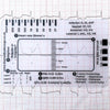A printed card showing a 7-step ECG ruler for EKG interpretation with various waveforms and measurements.